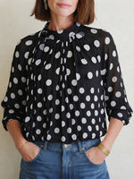 Elegant, Loose-fitting Women's Blouse Featuring Polka Dots, A Tie-neck, And Sheer Lantern Sleeves