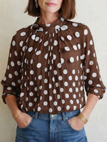Elegant, Loose-fitting Women's Blouse Featuring Polka Dots, A Tie-neck, And Sheer Lantern Sleeves