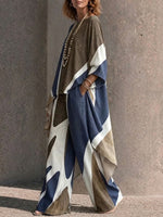 Two-piece Set Featuring An Asymmetrical Draped Top And Wide-leg Trousers With A Fluid Drape