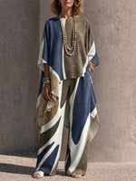 Two-piece Set Featuring An Asymmetrical Draped Top And Wide-leg Trousers With A Fluid Drape