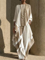 Two-piece Set Featuring An Asymmetrical Draped Top And Wide-leg Trousers With A Fluid Drape