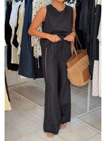 Casual Two-piece Set Featuring A Sleeveless Linen-cotton Blend Top And Trousers With Cut-out Webbing Details.