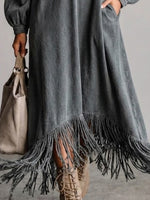 Washed, Distressed, Loose-fit Denim Dress Featuring A V-neck, Long Lantern Sleeves, And A Fringed Hem