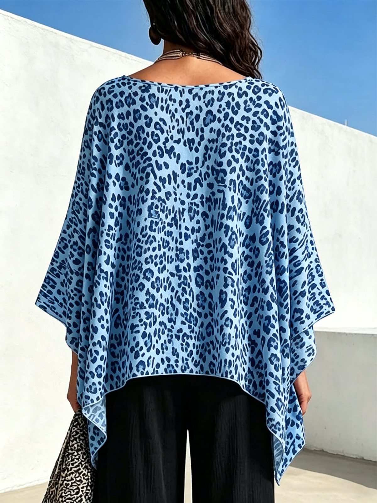 Leopard-print Top With A Round Neck, Asymmetrical Hem, And Batwing Sleeves