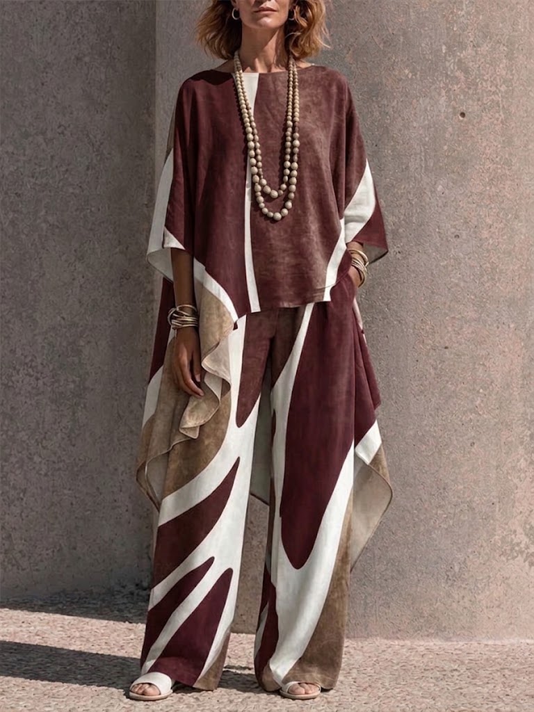 Two-piece Set Featuring An Asymmetrical Draped Top And Wide-leg Trousers With A Fluid Drape
