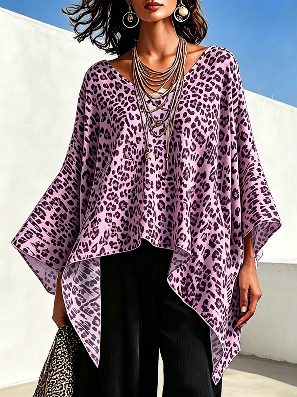 Leopard-print Top With A Round Neck, Asymmetrical Hem, And Batwing Sleeves