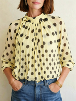 Elegant, Loose-fitting Women's Blouse Featuring Polka Dots, A Tie-neck, And Sheer Lantern Sleeves